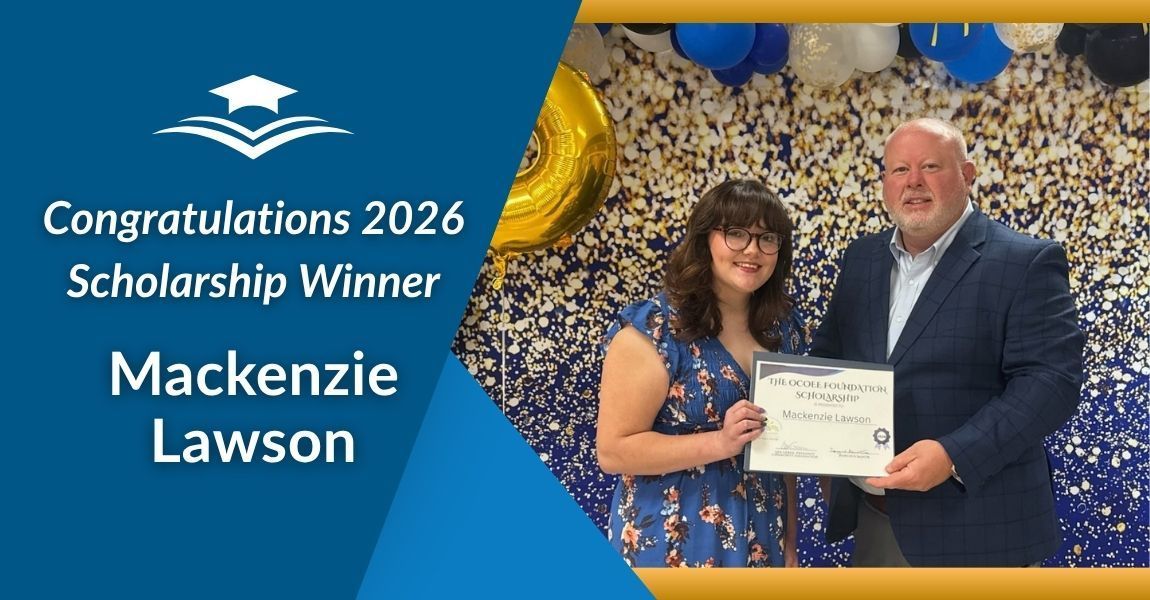 2026 scholarship winner Mackenzie Lawson holding certificate with presenter on blue and gold backdrop