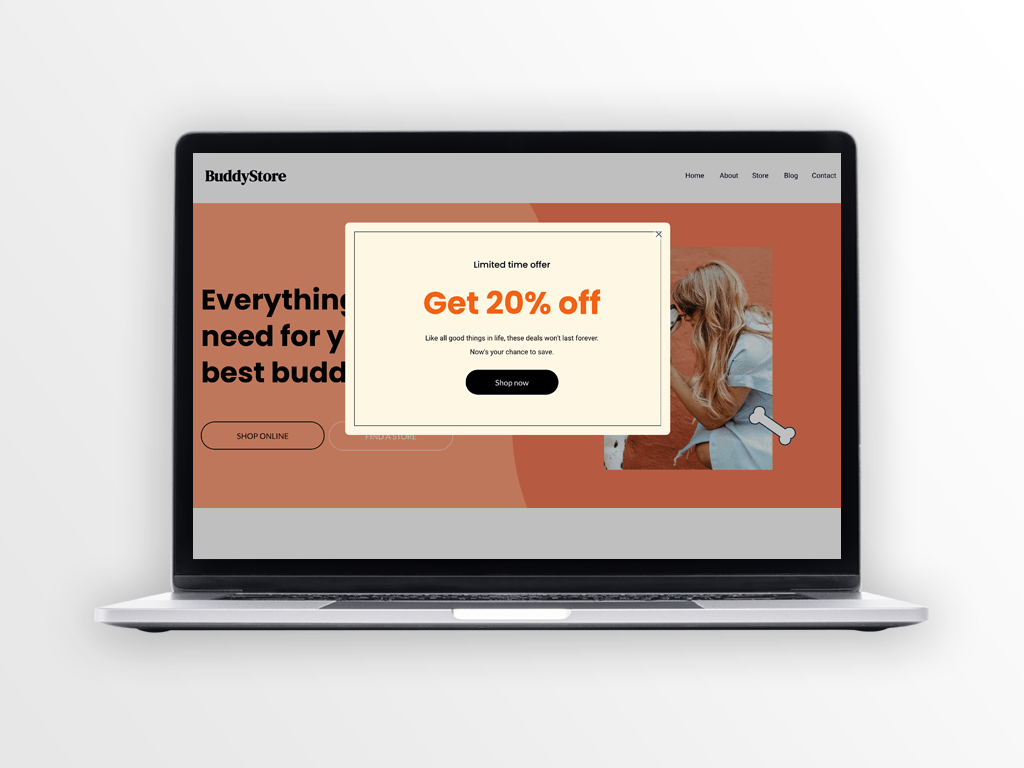 Laptop displaying website with orange and beige elements, featuring a pop-up offering 20% off.