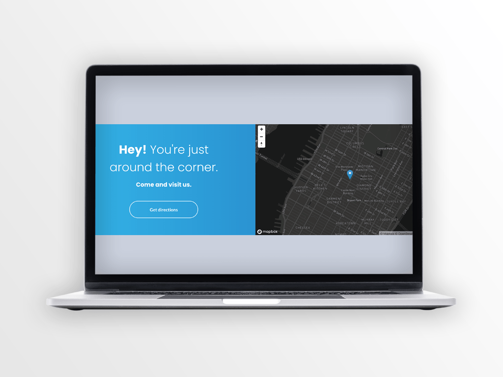 Laptop screen showing a blue welcome section with text and a map of a city.