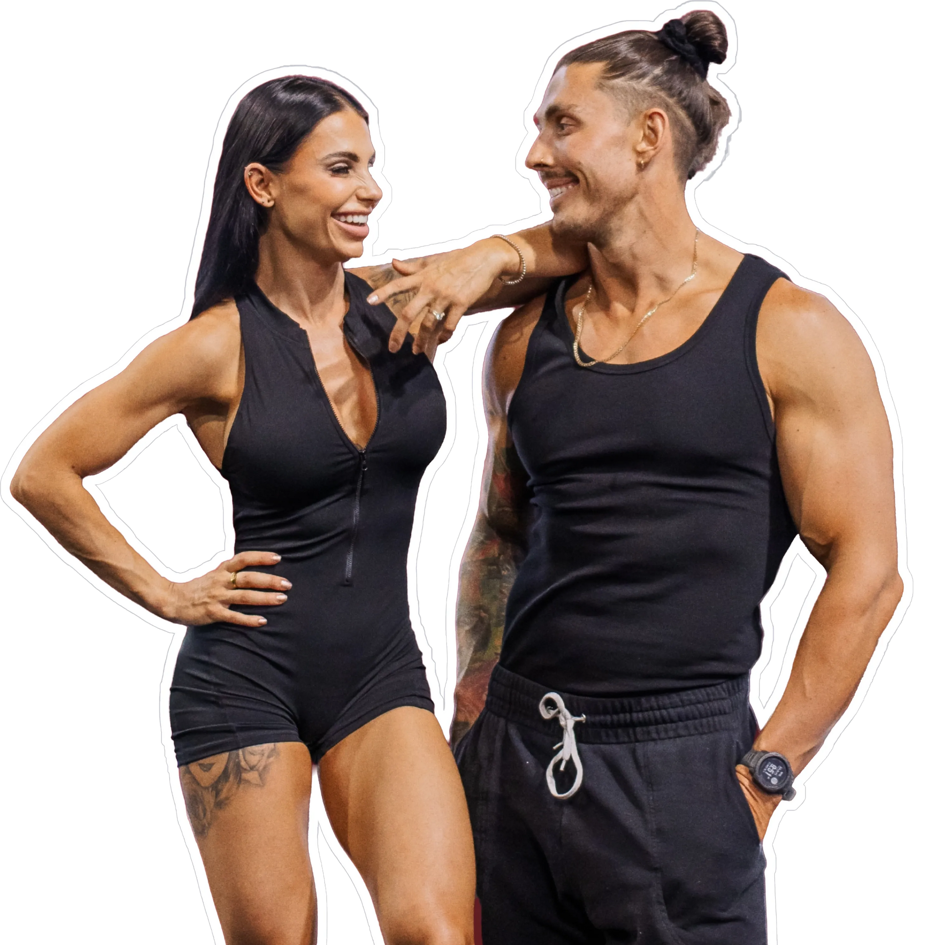 Two fit people in black athletic wear smiling and posing against a white background. AMPT COACHING
