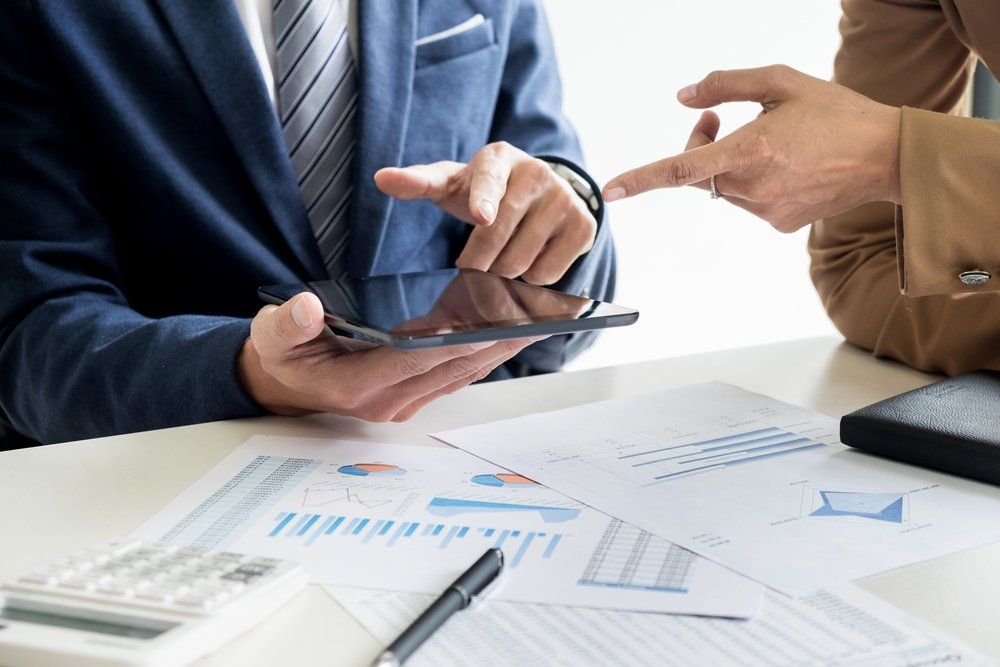 Businessman Calculating Balance — Accountants & Bookkeepers in Southern Highlands