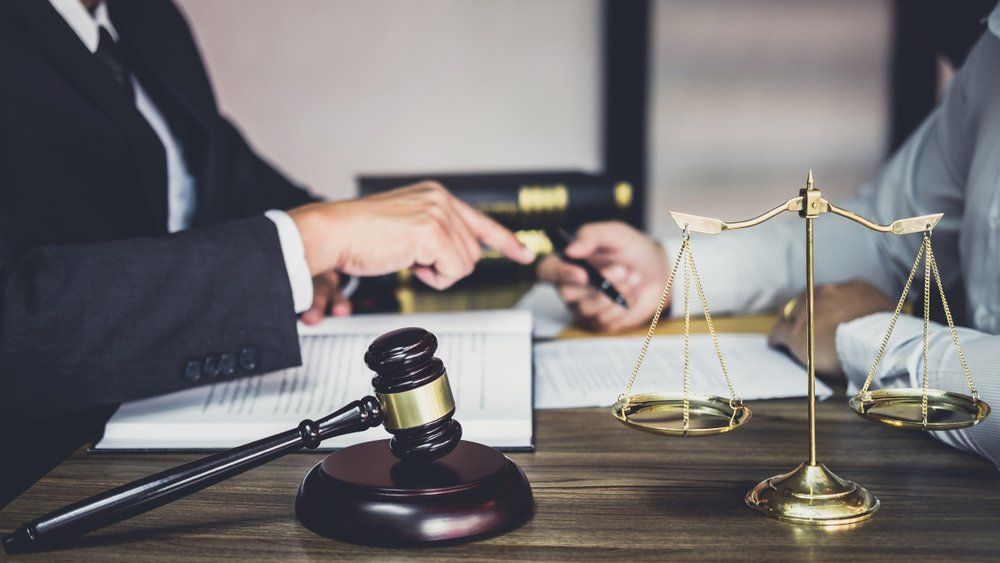 Lawyer & Accountant Discussing Documents — Accountants & Bookkeepers in Southern Highlands