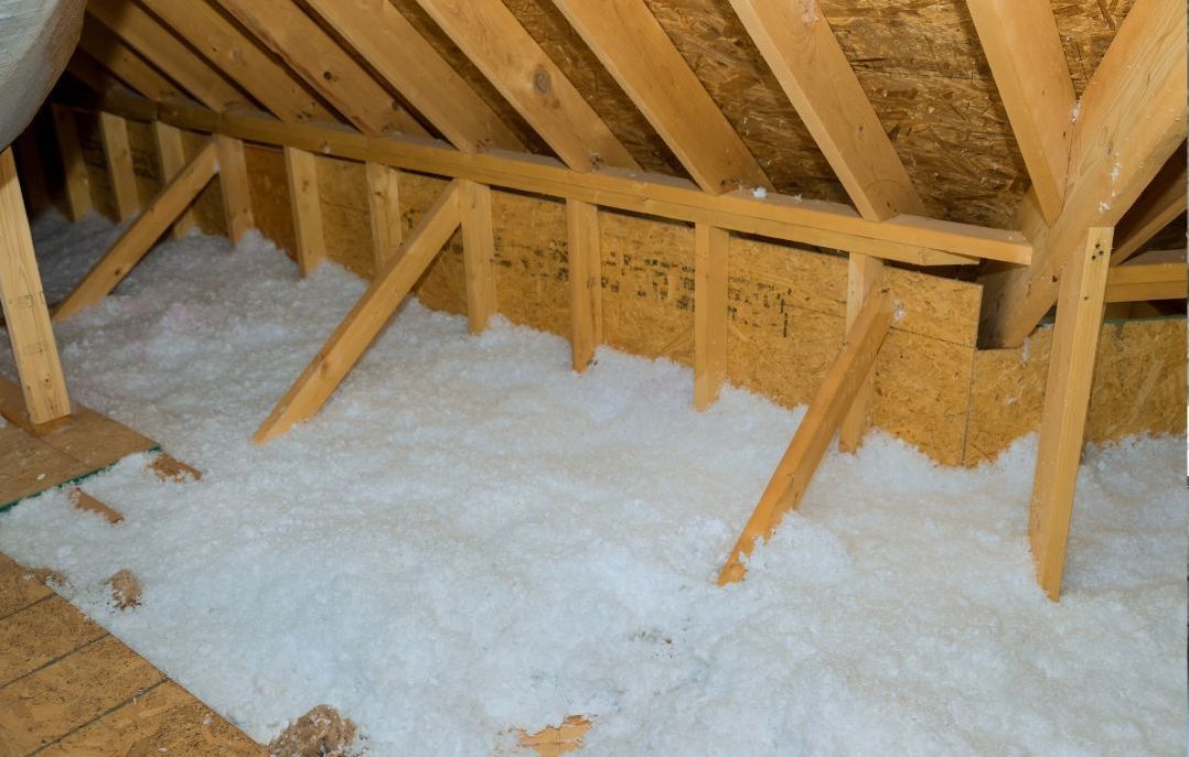 Empty attic with foam insulation | Badgerland Restoration & Remodeling blog tips | New London WI | Waupaca WI | Wausau WI