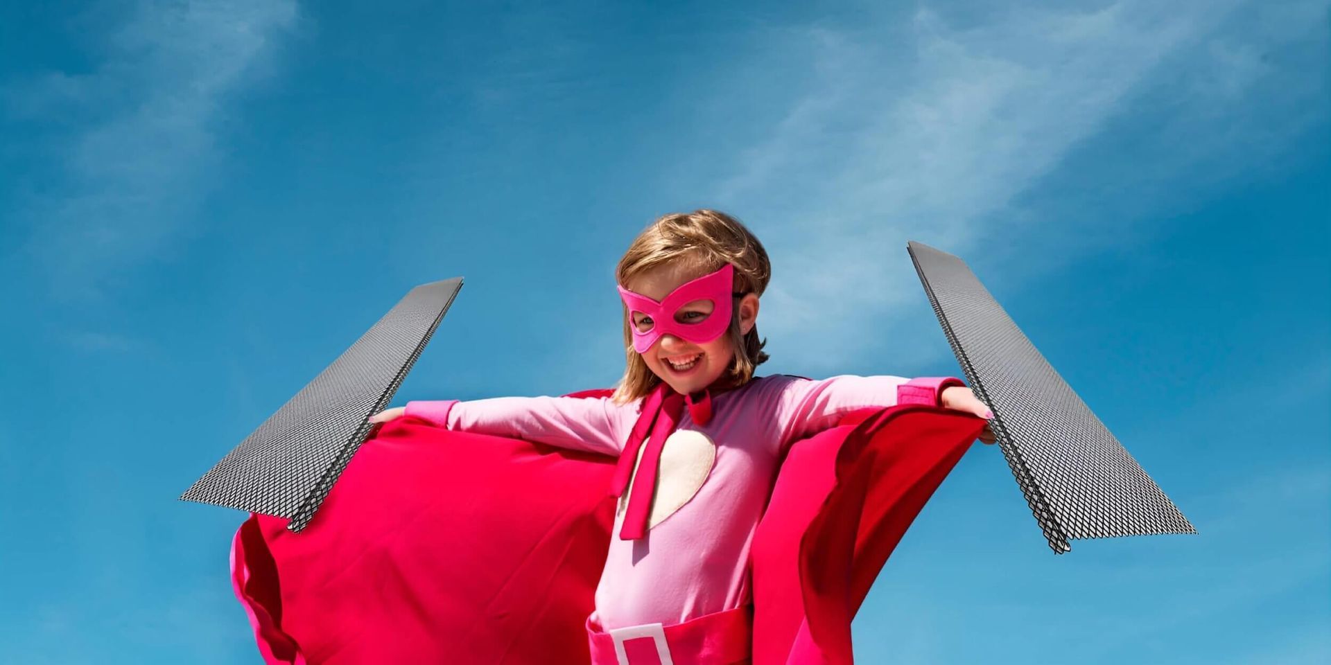 Little girl in super hero cape & mask holding gutter guard screens by  Badgerland Restoration & Remodeling - Waupaca WI