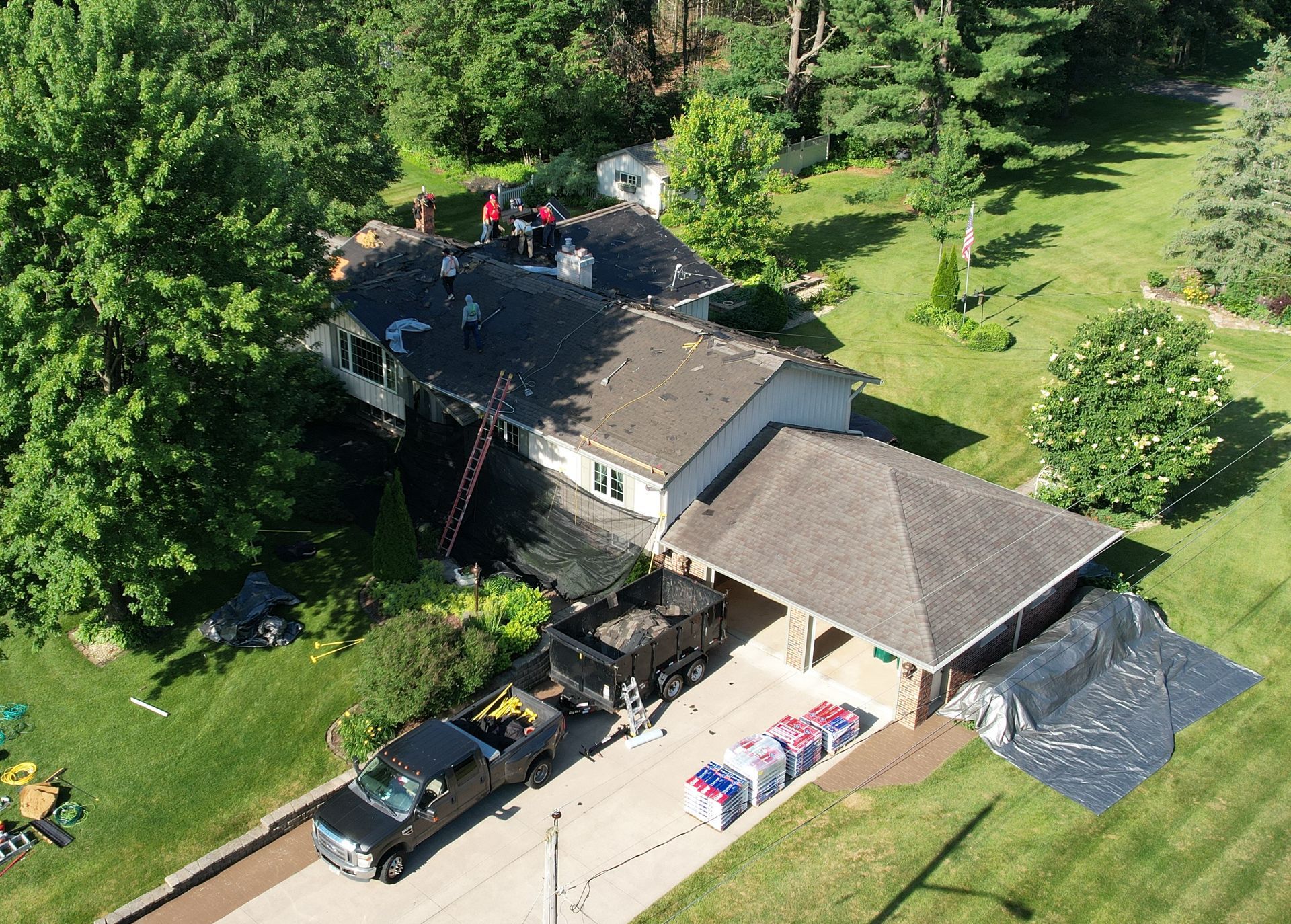 Residential shingled roof being replaced by home contractor Badgerland Restoration & Remodeling in Clintonville WI