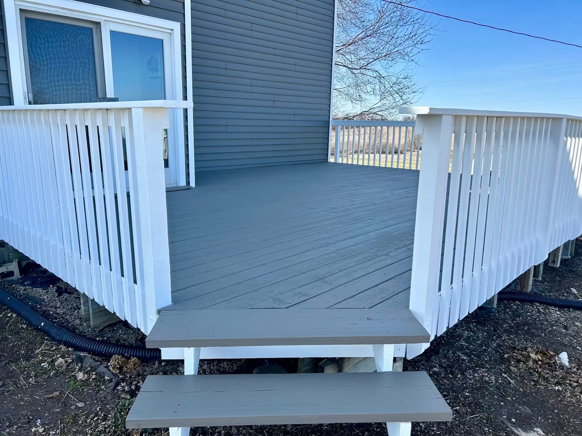 Renew Plastics white composite deck replacement Chain O’ Lakes in Waupaca WI Badgerland Restoration & Remodeling Contractor