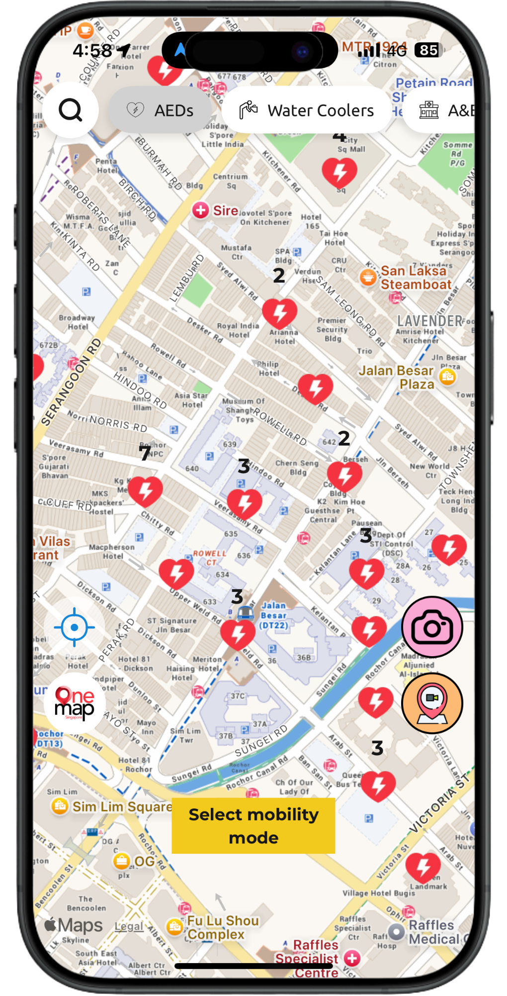Smartphone screen showing a map with many red location pins and a yellow “select visibility area” button.