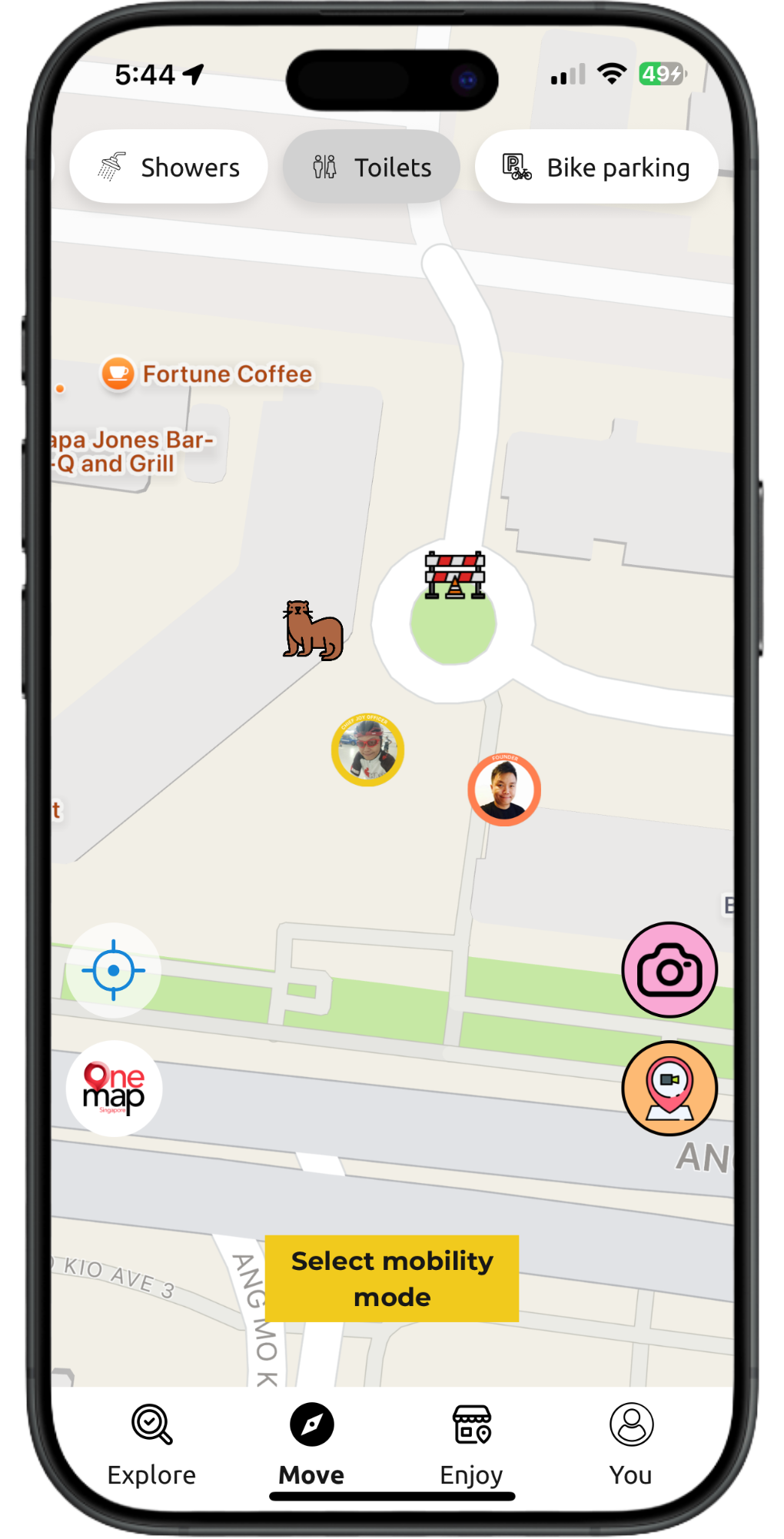 Phone showing a map app with multiple nearby markers, a yellow popup, and a bottom navigation bar