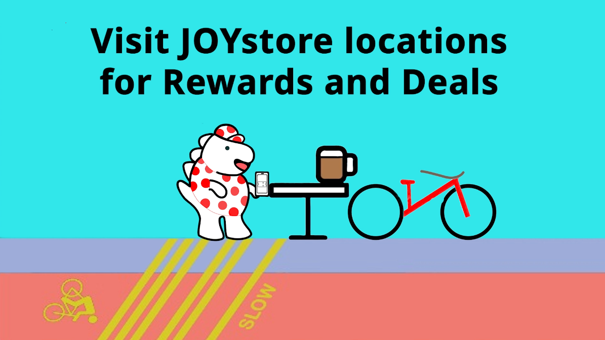 JOYstore promo banner: polar bear at table with coffee and bicycle, text about rewards and deals