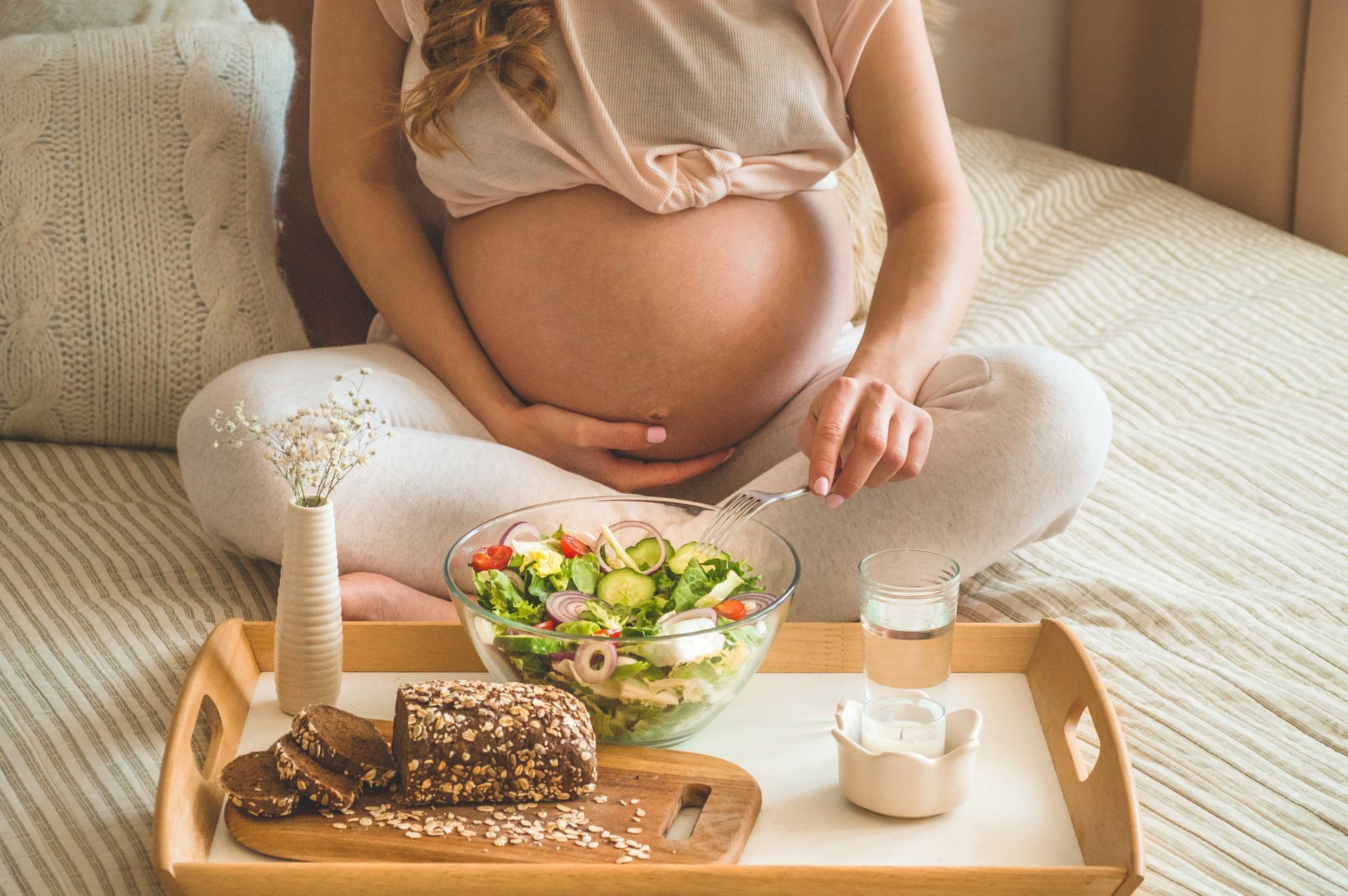 Pregnant women with a salad