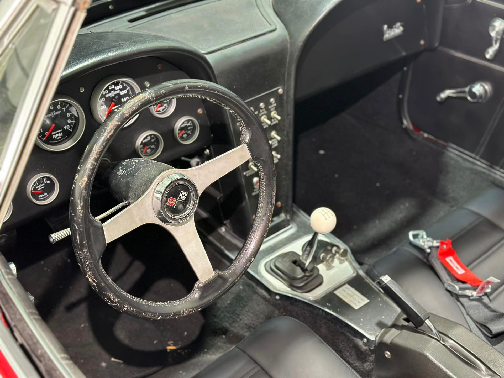 A close up of a steering wheel in a car