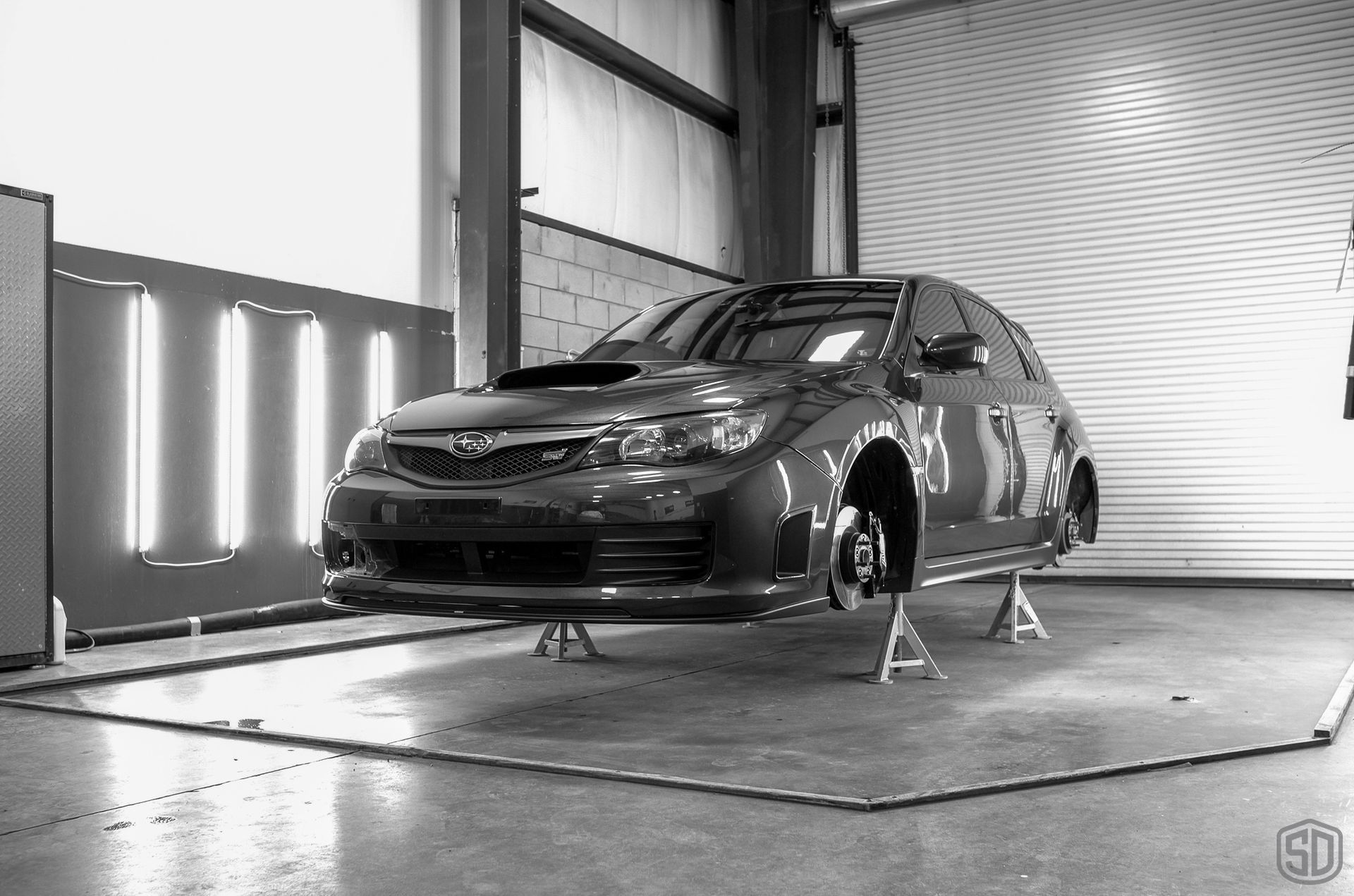2010 Subaru WRX STI Signature Suspension Detail - wheels, suspension, and brake calipers wheels off detailing Florida, USA