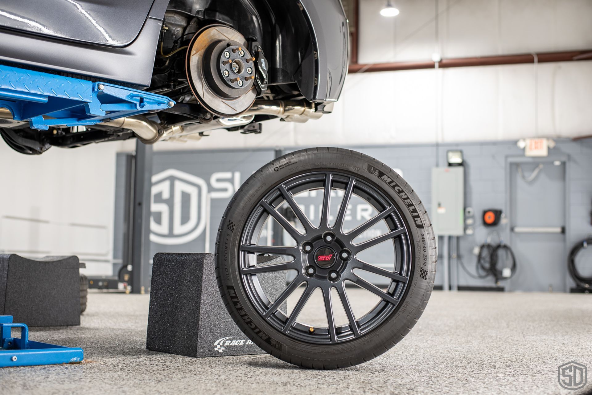 2010 Subaru WRX STI Signature Suspension Detail - wheels, suspension, and brake calipers FL USA