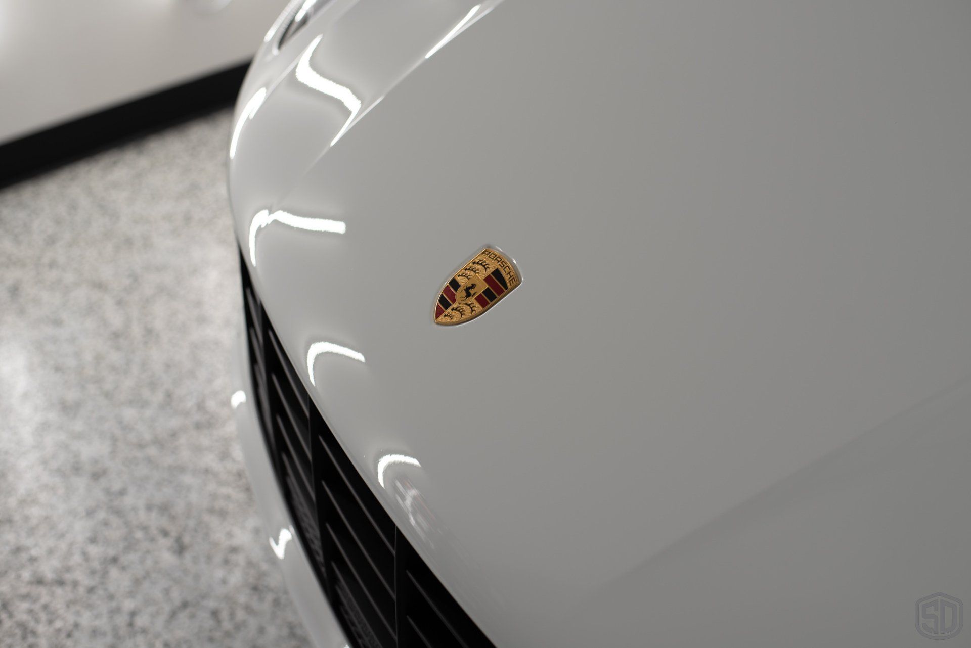 2019 Porsche Macan high end detailing Modesta BC-06 water repellent glass coating front hood emblem close up Orlando Florida