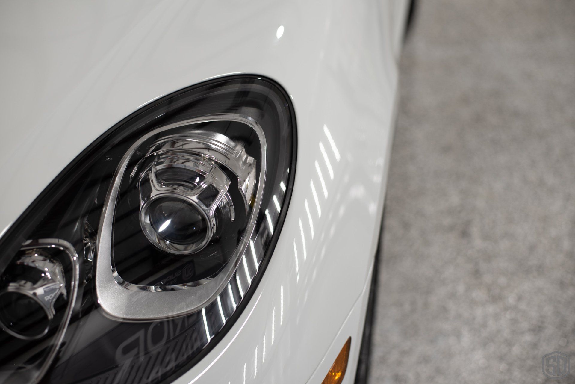 2019 Porsche Macan high end detailing Modesta BC-06 water repellent glass coating headlight close up Orlando Florida