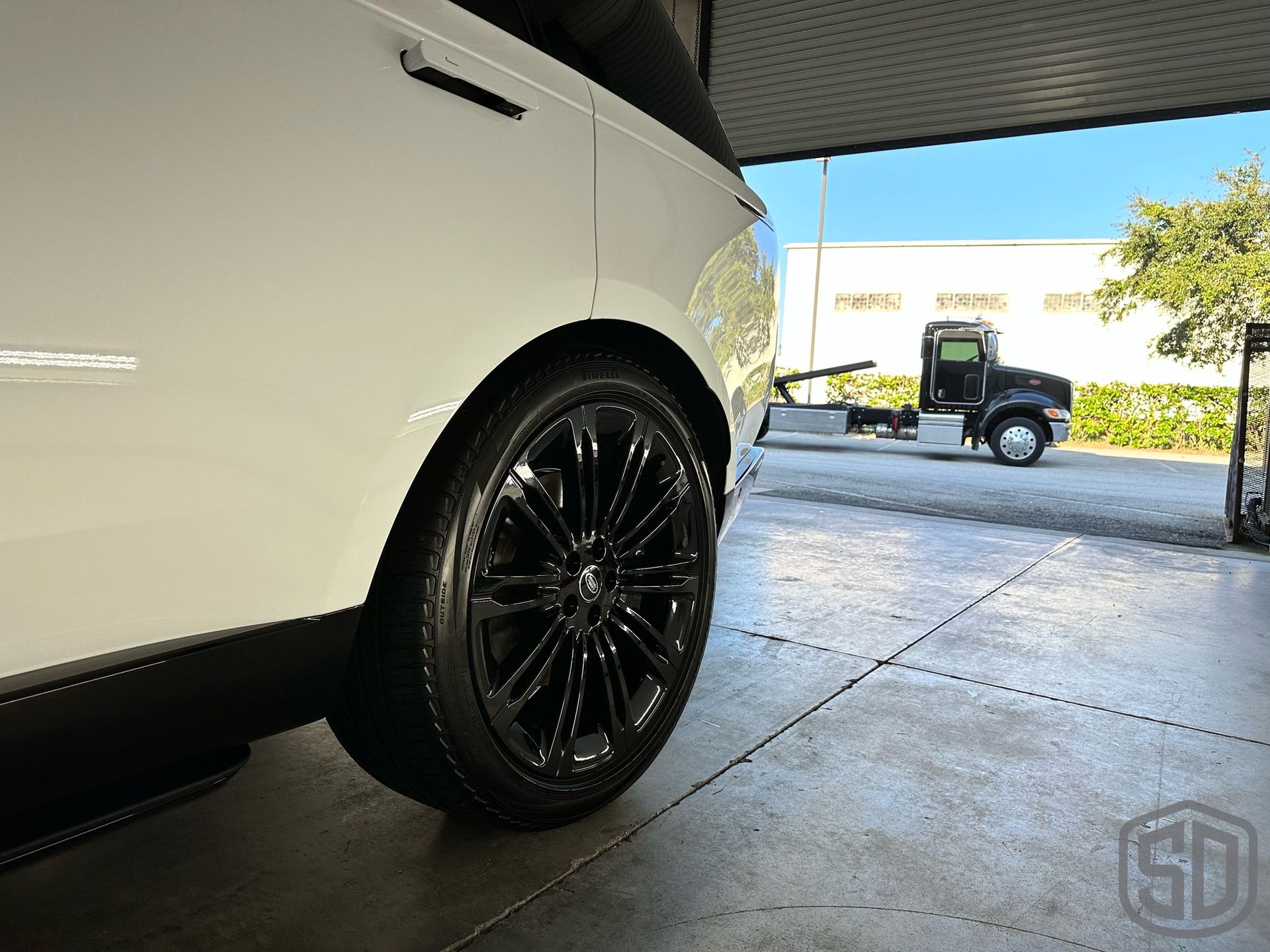 2023 Land Rover Range Rover Autobiography Detailing, Suntek Paint Protection Film, Ceramic Window Film, Modesta BC-06 Top Coat, Exterior Glass Coating, and BC-04 Nano-Titanium Coating rear wheel detail Orlando, FL