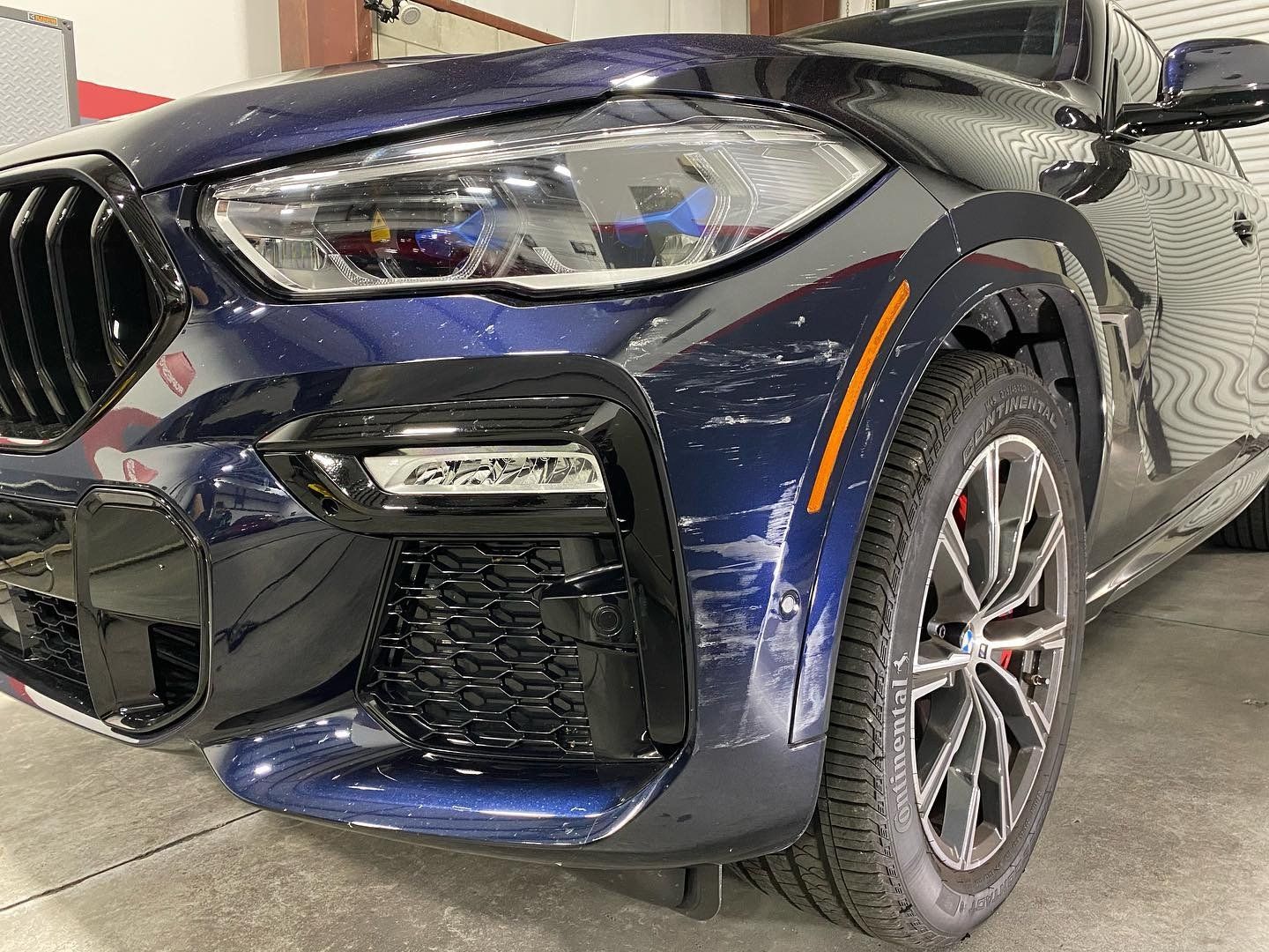 BMW X6 M50i Xpel Paint Protection Film and Modesta BC-05 front fender scratch before orlando FL