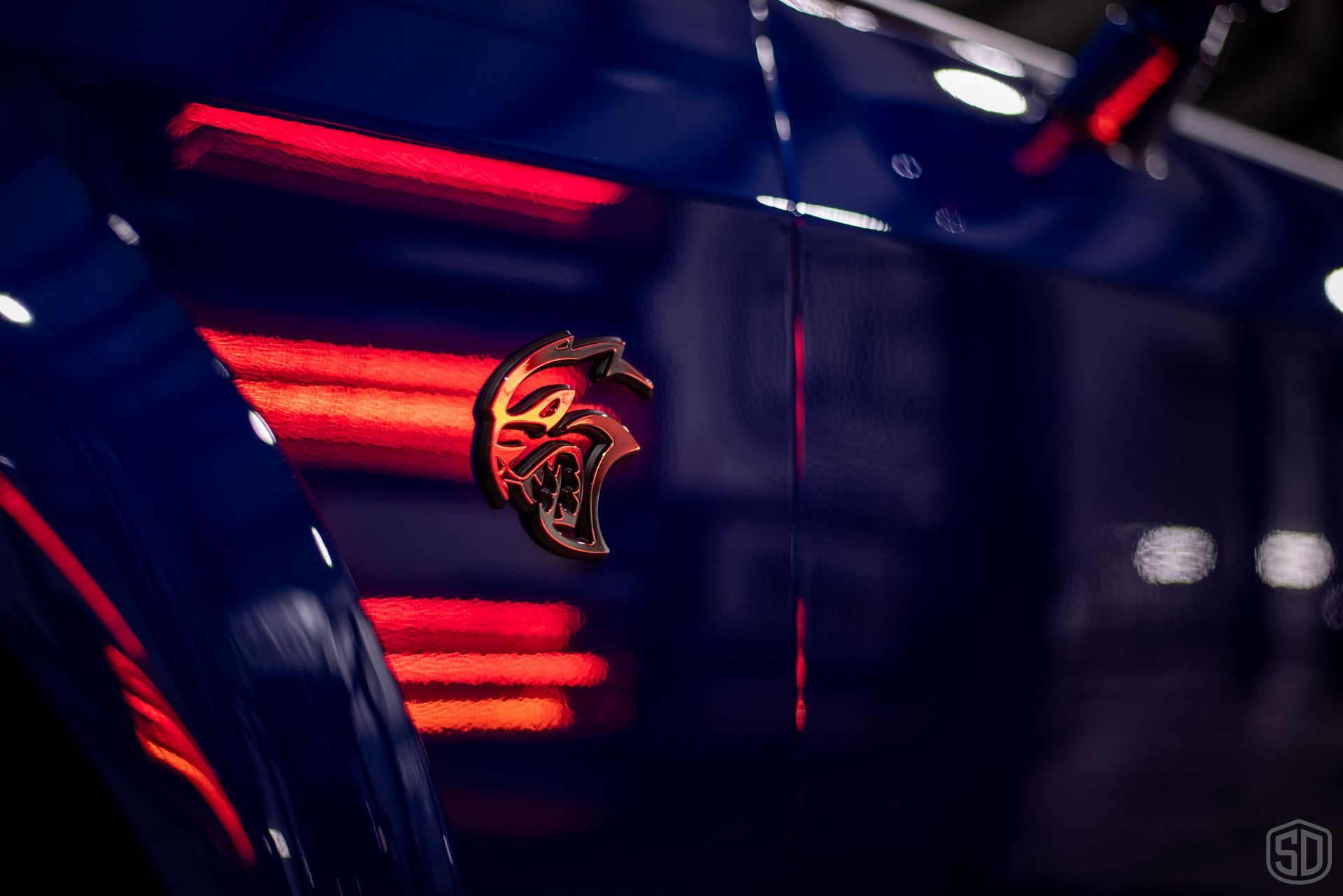 A close up of the rear end of a dodge srt hellcat.