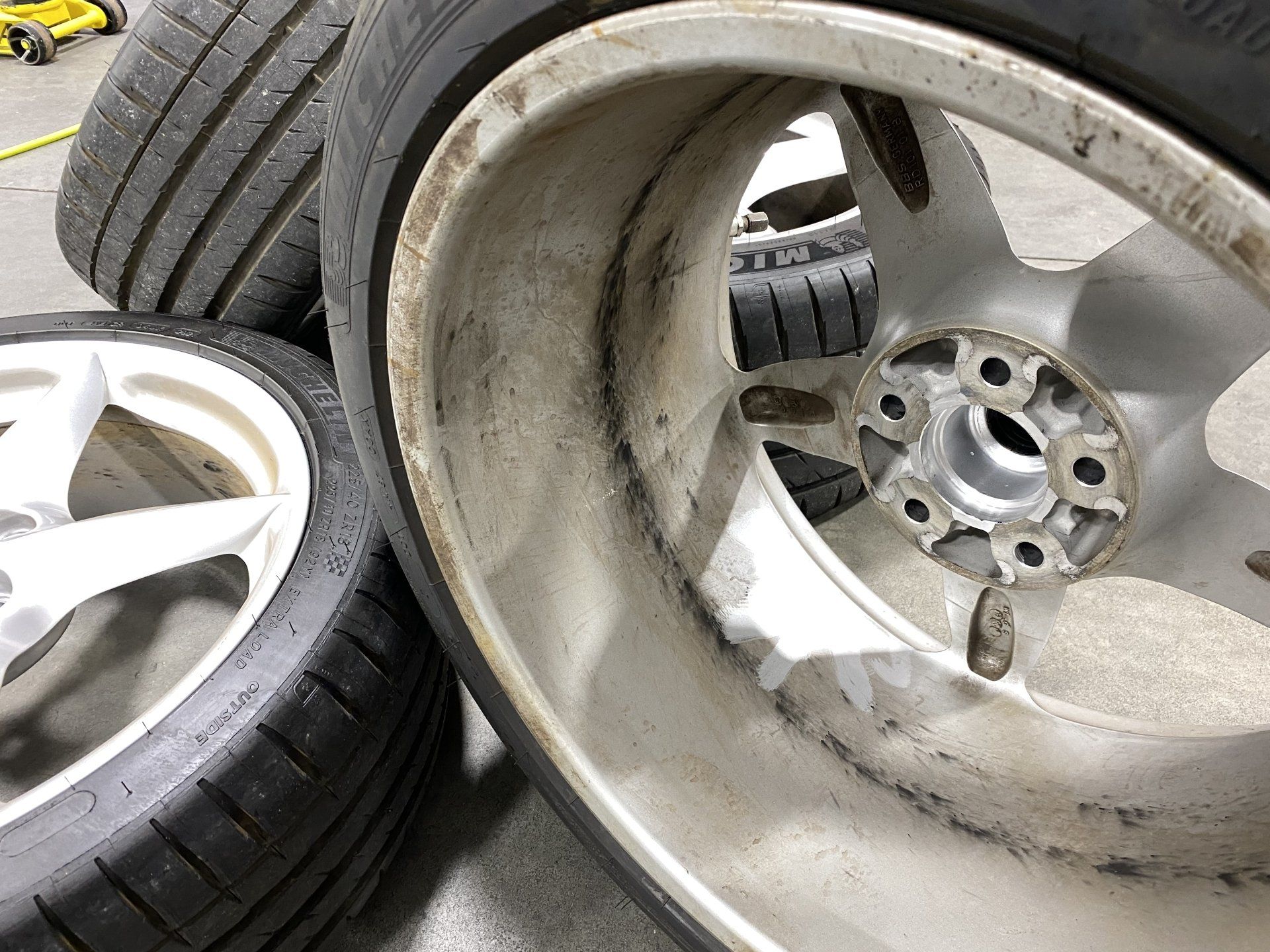 A close up of a wheel with a tire on top of it.