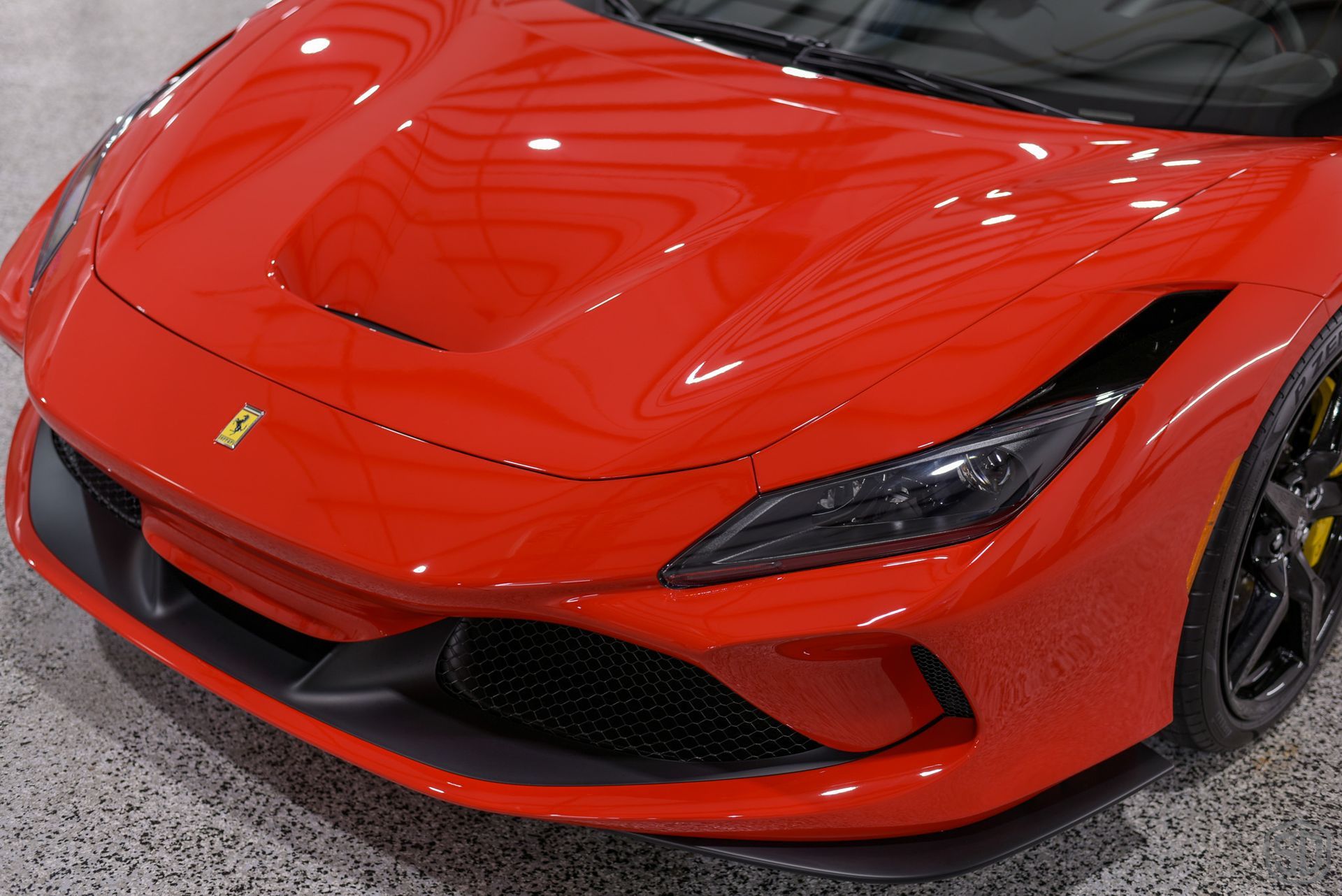 A red sports car with the letter x on the front
