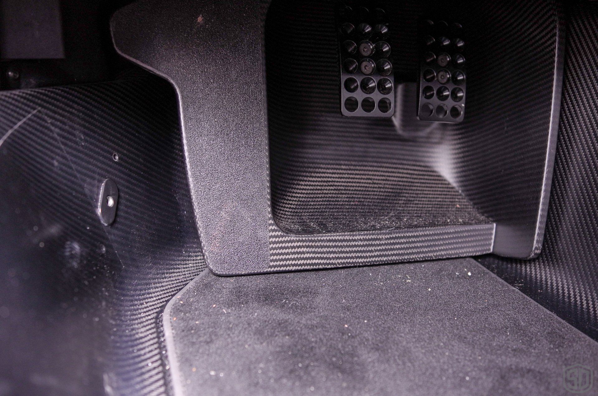 A close up of a brake pedal in a car