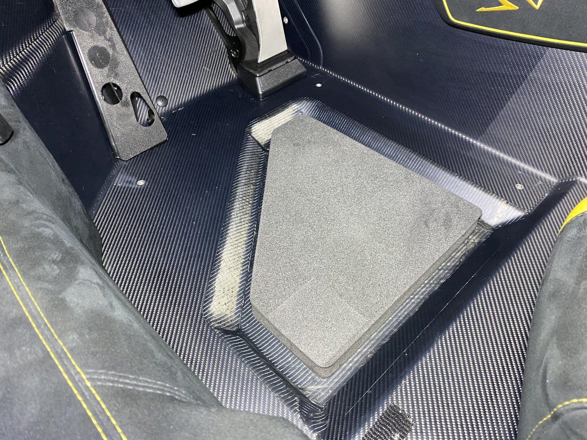 A close up of a steering wheel in a car.