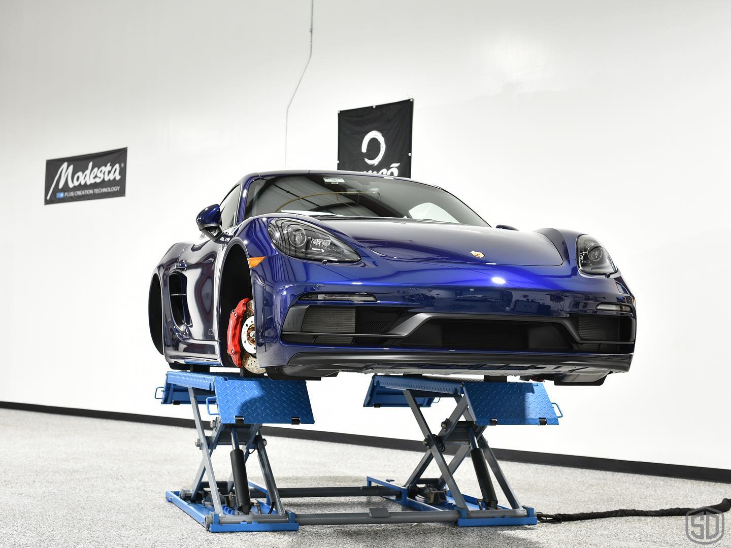 Gentian Blue Porsche Cayman 718 GTS wheels off detailing
