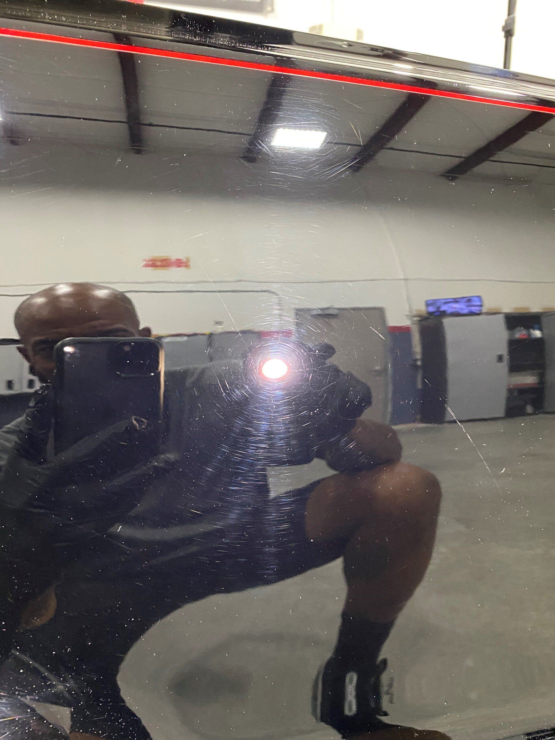 A man taking a picture of himself in a mirror