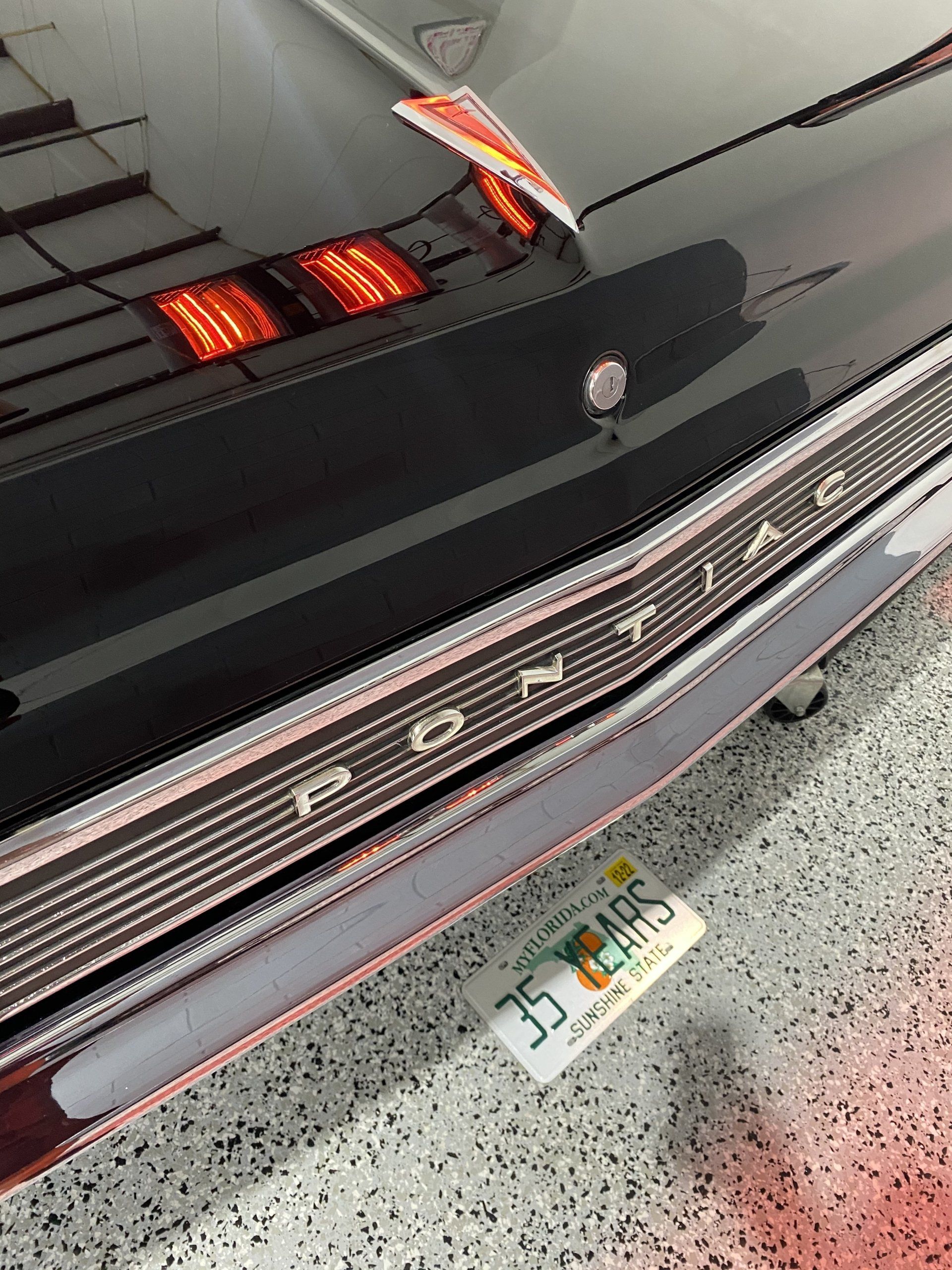 A pontiac car is parked in a garage