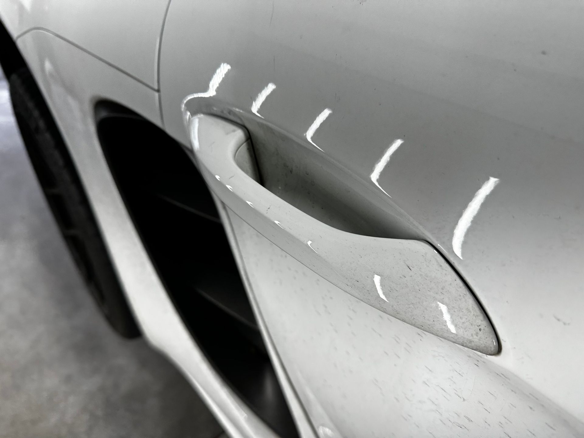 Porsche Cayman S Maintenance Detail with Aenso door handle close up Orlando, Florida USA