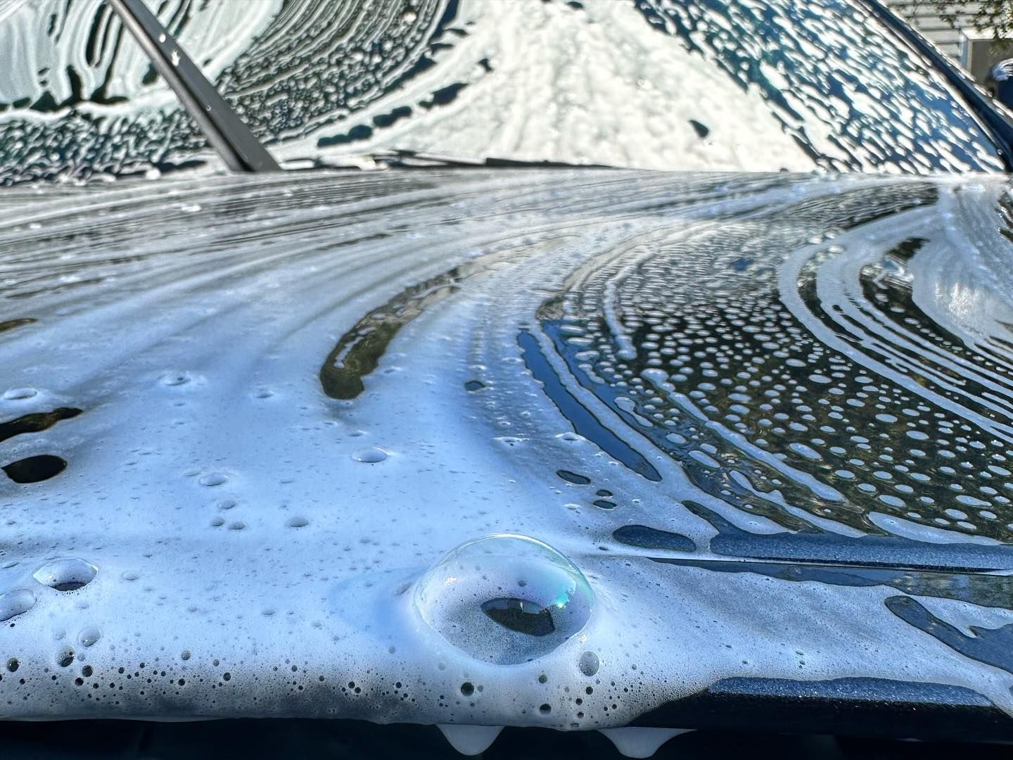 Subaru WRX Car Detailing with Aenso Polaris Foam Soap hood close up Orlando, Florida USA