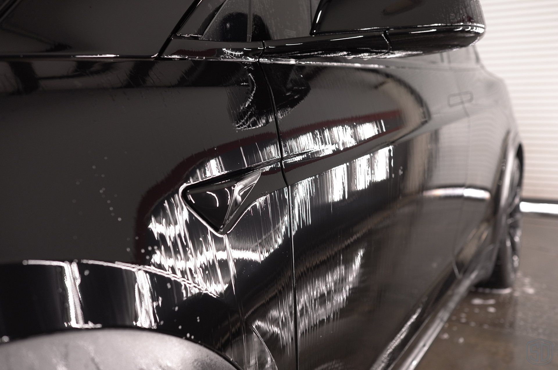 Tesla Plaid X Paint Correction, Paint Protection Film, and Modesta BC-08 Ceramic Coating side panel close up Orlando, Florida USA