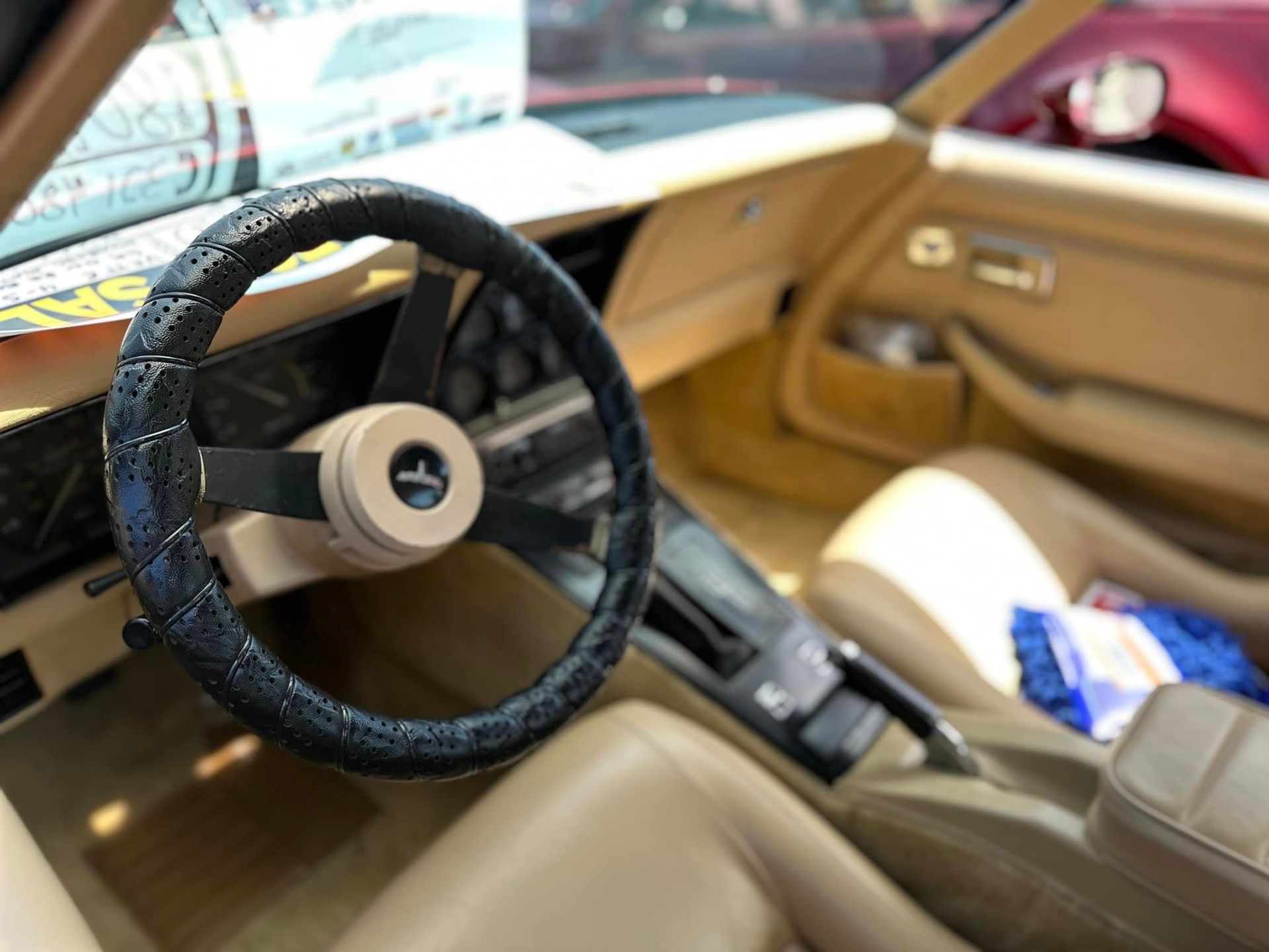 A close up of a steering wheel in a car