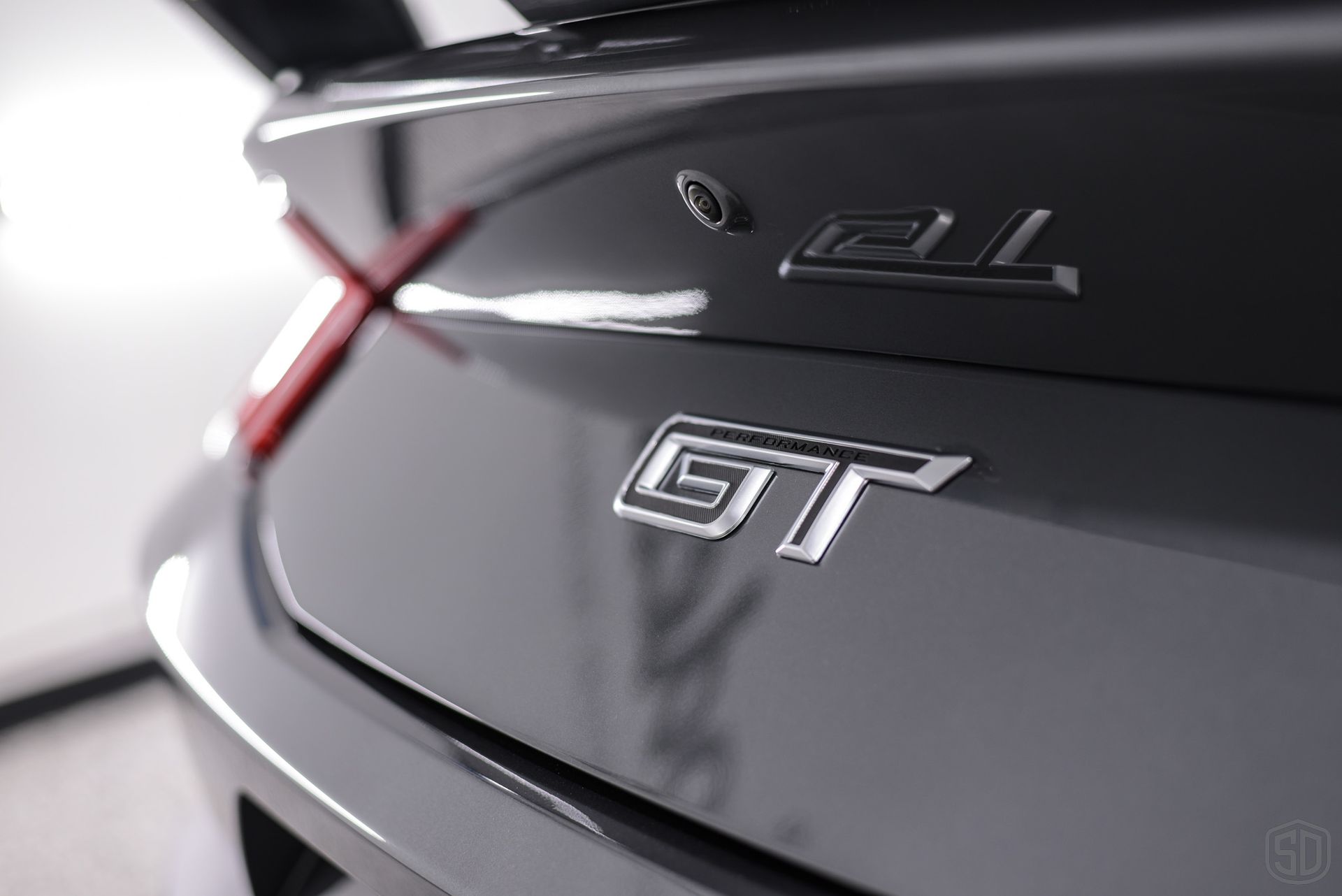 A close up of the back of a car with the letters gt on it
