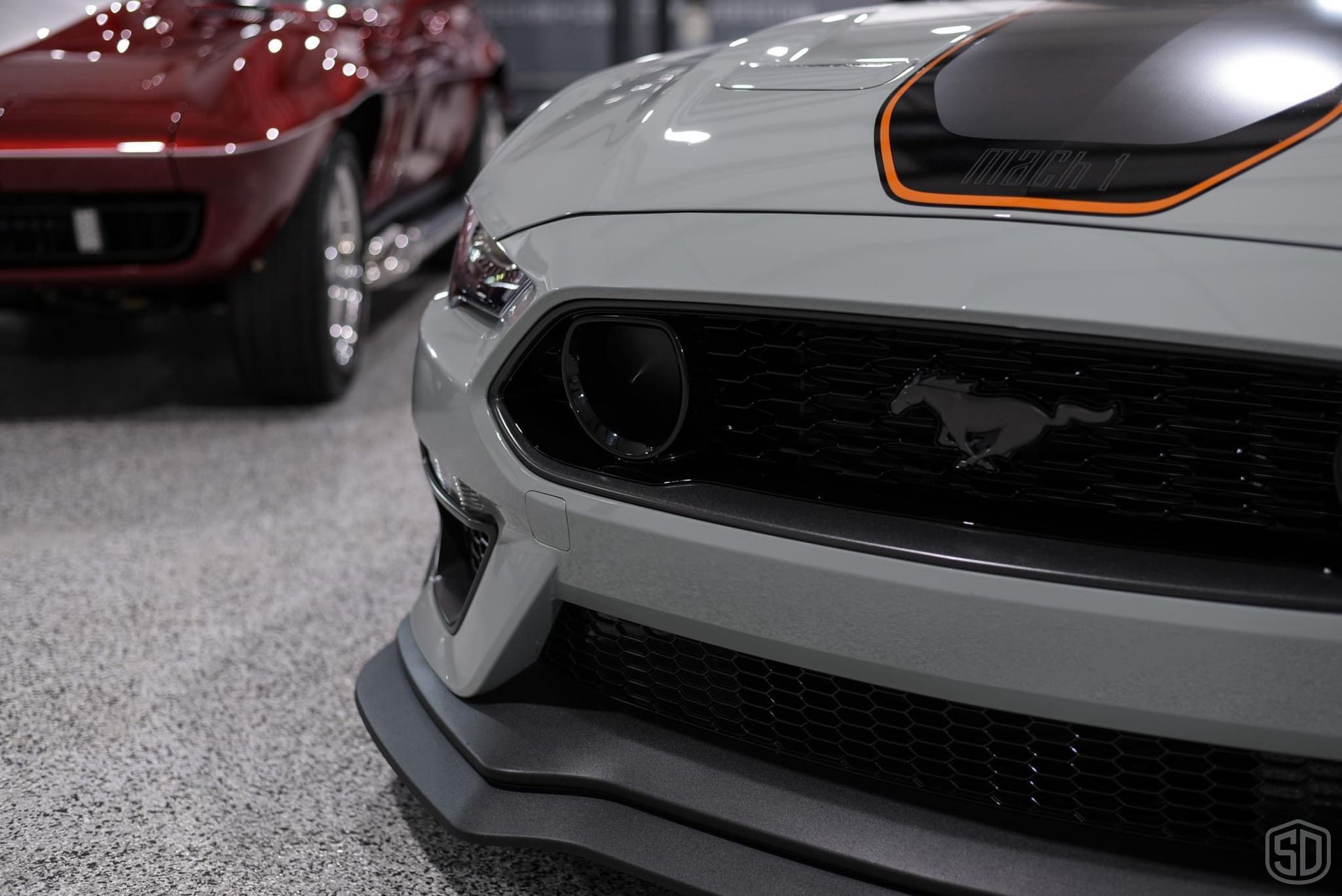 A close up of the front of a ford mustang.