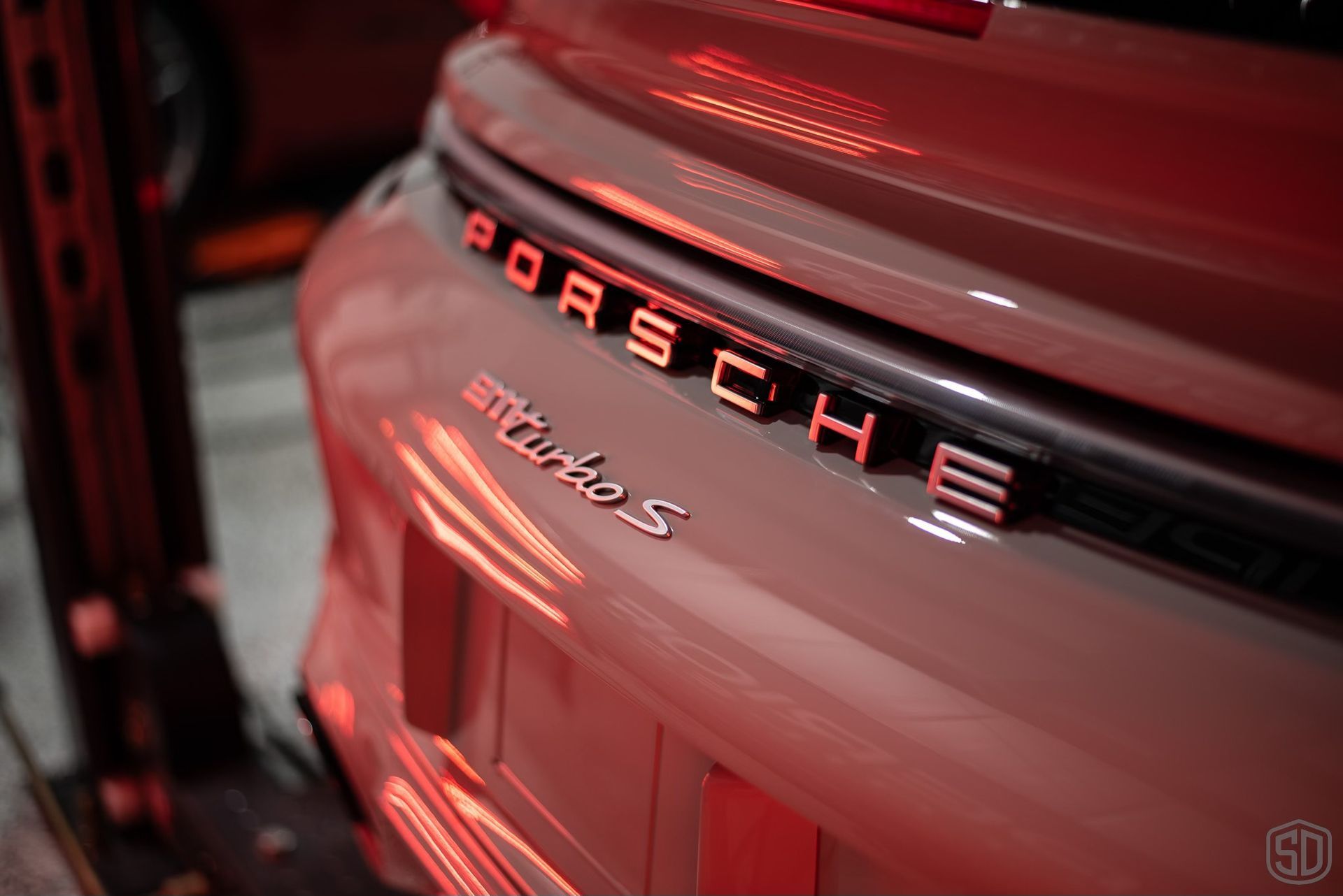 A close up of the rear end of a porsche turbo s.