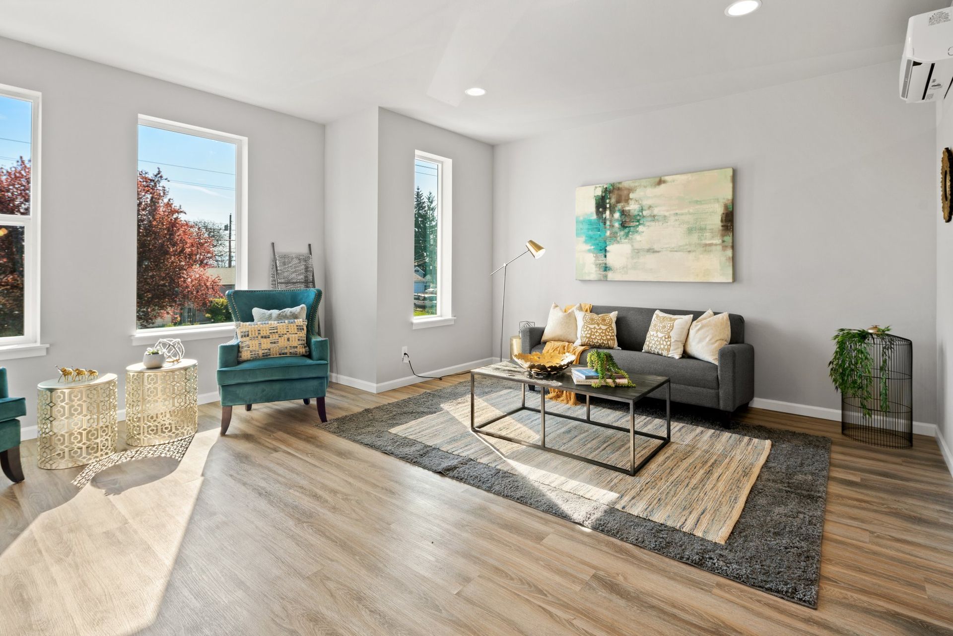 Bright living room with plenty of natural lighting - select to go to Pay Rent Online