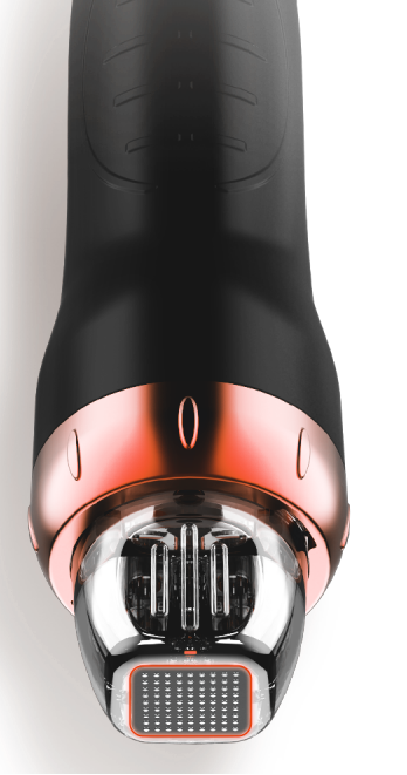 A close up of a black and gold device on a white background.