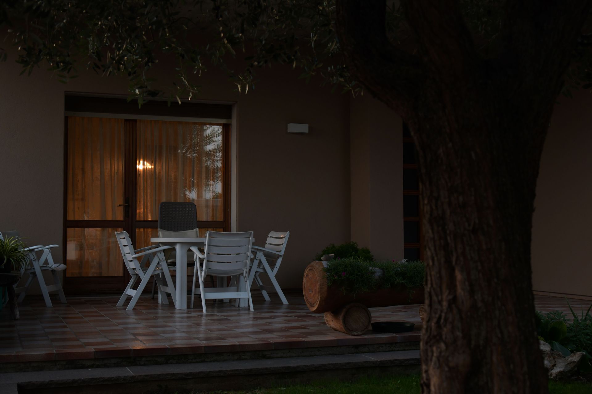 Dark, vulnerable patio with poor lighting