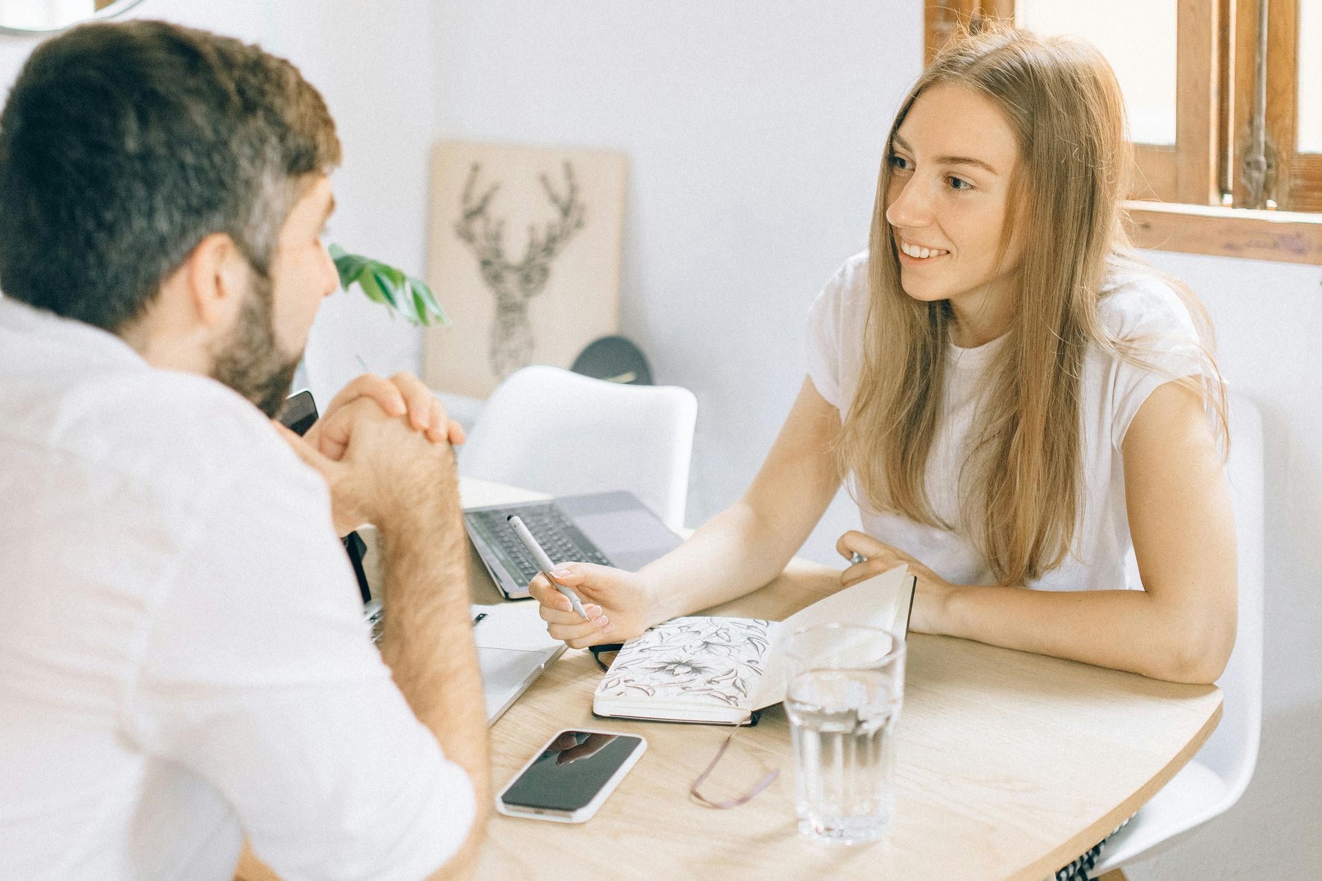 Property manager discussing performance with landlord.
