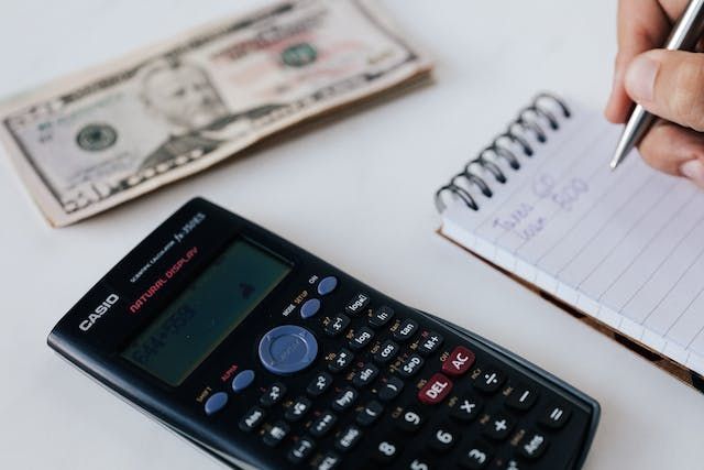 calculator-and-cash-on-a-table
