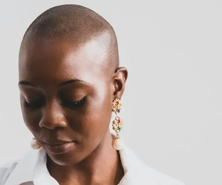 A woman with a shaved head
