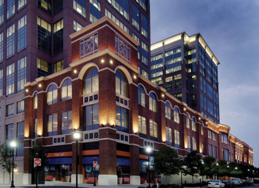 A large brick building is lit up at night