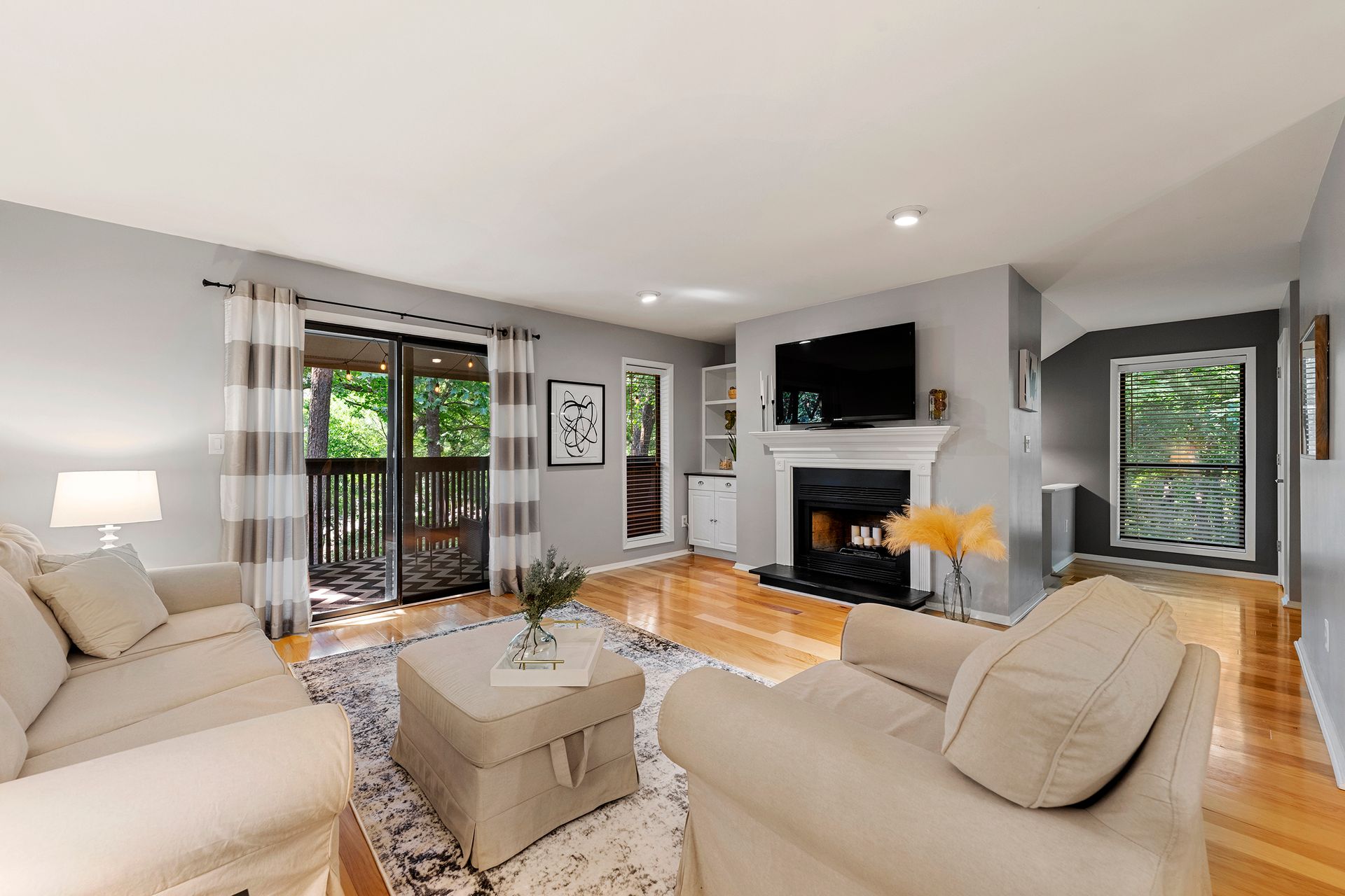 A living room filled with furniture and a fireplace.