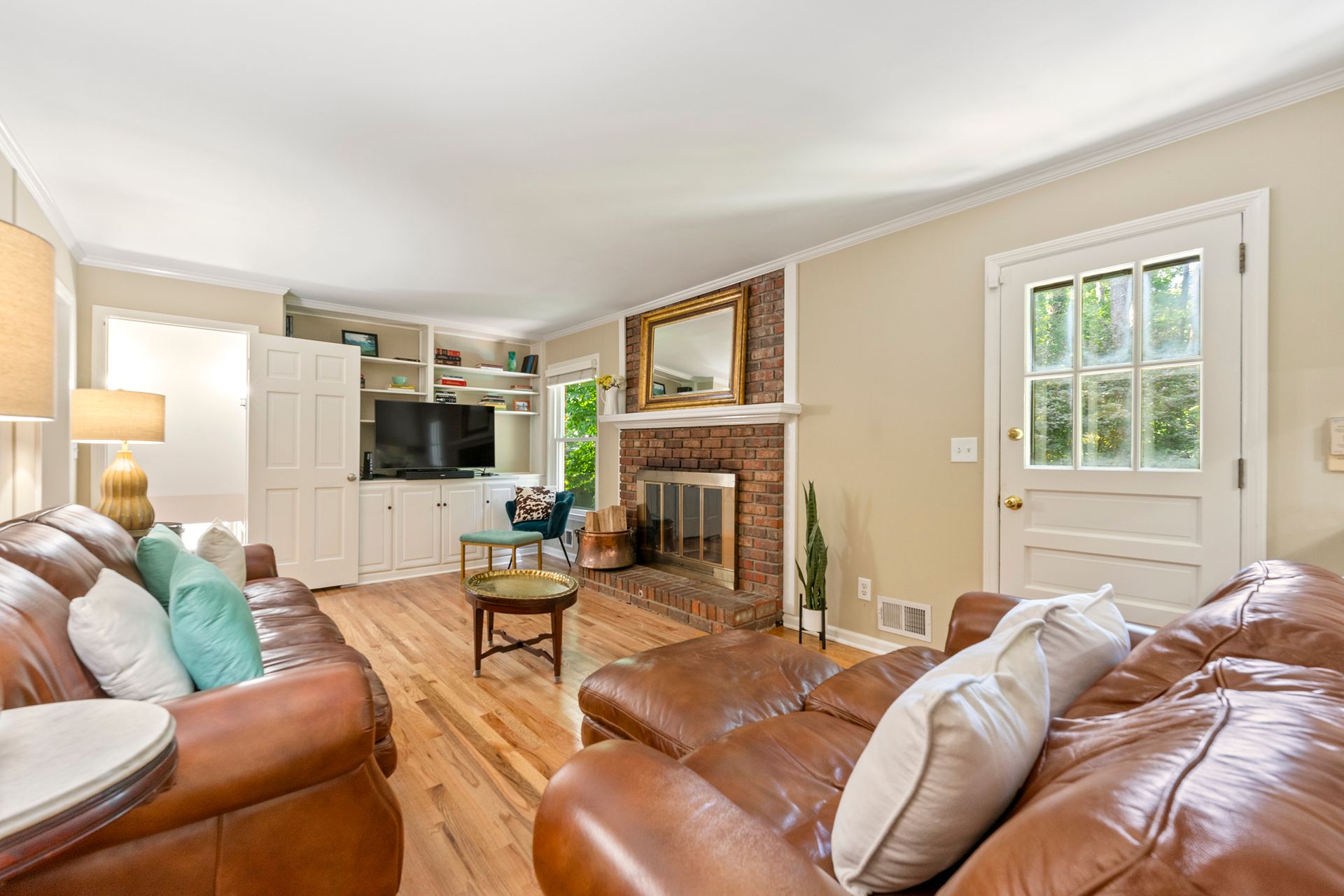 A living room filled with furniture and a fireplace.
