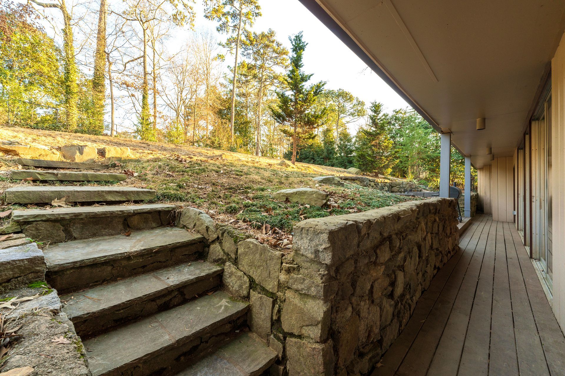 A stone wall with stairs leading up to it