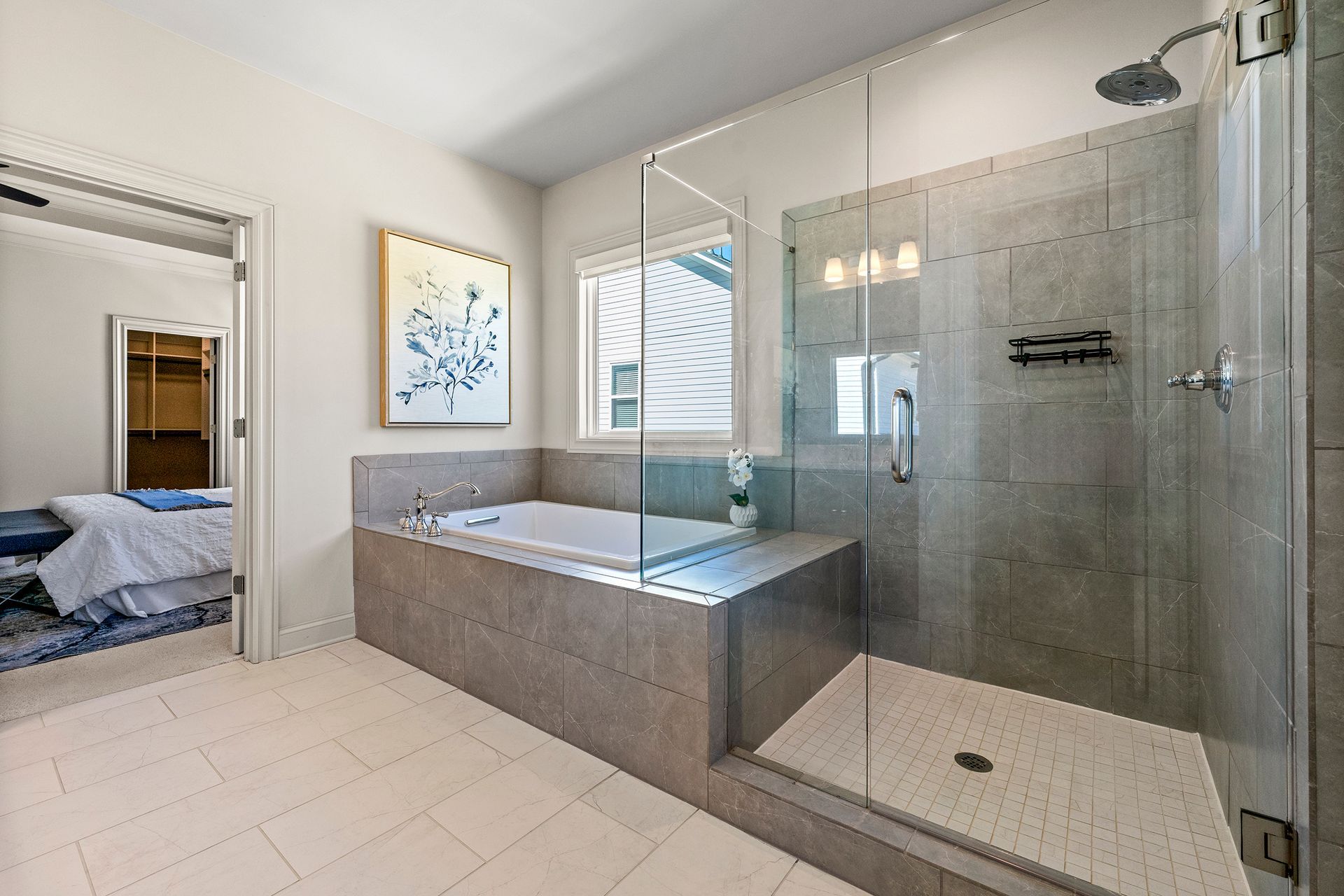 A bathroom with a bathtub and a walk in shower.