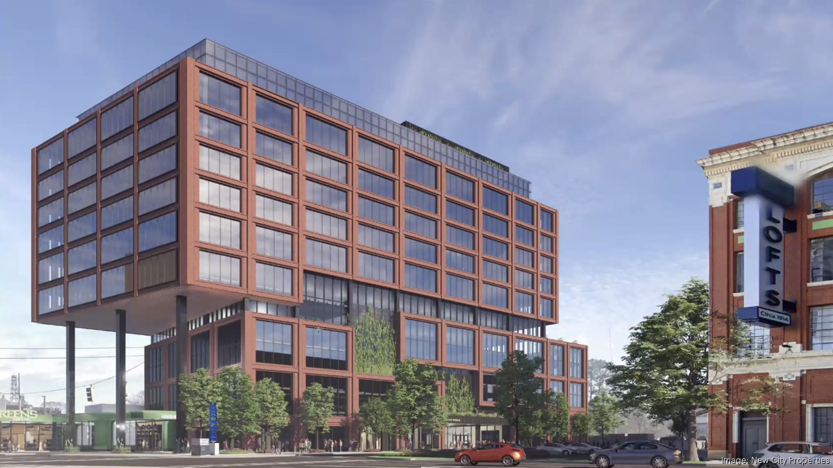 A modern brick and glass building with a cantilevered upper section, standing next to a historic loft building.