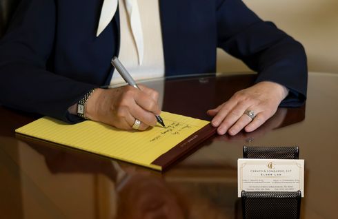 Attorney Cerato carefully taking notes during a meeting with a client in Stroudsburg, PA