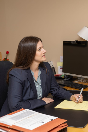 Attorney Lombardo looking at a client and listening to their needs carefully